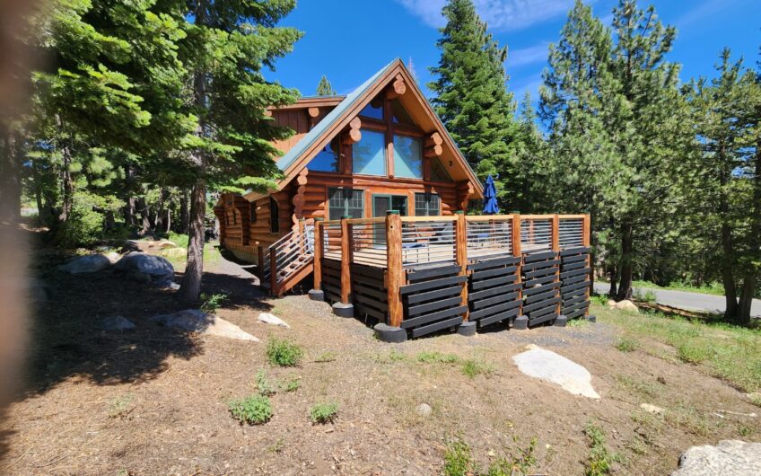 Log Home in a field of Aspen